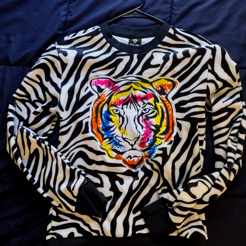 Zebra print tiger emblem crew neck sweater